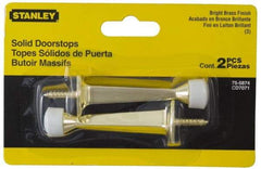 Stanley - 3" Projection Solid Door Stop - Wall Mount, Antique Brass Finish - Exact Tool & Supply