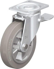 Blickle - 8" Diam x 2" Wide x 9-41/64" OAH Top Plate Mount Swivel Caster with Brake - Solid Rubber, 1,210 Lb Capacity, Ball Bearing, 5-1/2 x 4-3/8" Plate - Exact Tool & Supply