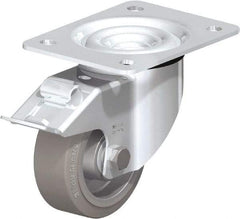Blickle - 4" Diam x 1-37/64" Wide x 5-7/64" OAH Top Plate Mount Swivel Caster with Brake - Solid Rubber, 440 Lb Capacity, Ball Bearing, 5-1/2 x 4-3/8" Plate - Exact Tool & Supply