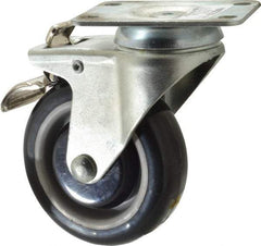 Value Collection - 4" Diam x 1-1/4" Wide x 5-13/32" OAH Top Plate Mount Swivel Caster with Brake - Polyurethane, 235 Lb Capacity, Ball Bearing, 2-7/8 x 3-5/8" Plate - Exact Tool & Supply